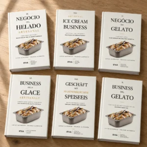 Las seis ediciones de «El negocio del helado artesanal» de IFHA sobre una mesa de madera: español, inglés, portugués, francés, alemán e italiano